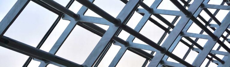 Aluminum curtain wall system assembled from CNC-machined mullions and transoms