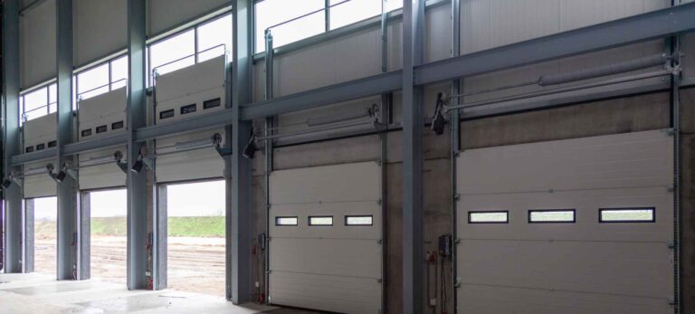 Commercial garage doors built from extruded rails and stiles processed at high volume