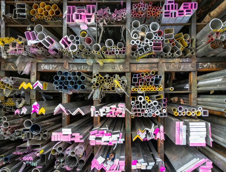 Racks of extruded aluminum profiles held in volume for high-volume cutting and fabrication