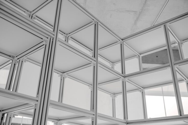 Modular aluminum T-slot framing structure assembled from extruded profiles